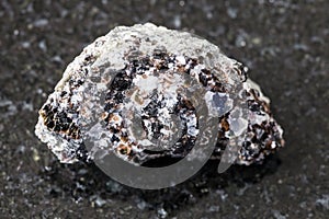 Raw Phlogopite magnesium mica rock on black