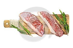 Raw picanha or Top Sirloin Cap steak on a chopping Board. Isolated on white background. Top view.