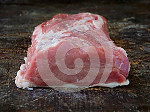 Raw piece of pork loin, breast. For steak, roasting, stewing, roasting.