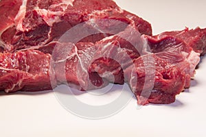 Raw pieces of beef meat for stew , goulash or ragout