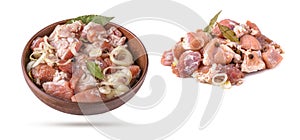 Raw pieces of pork shish kebab in a marinade with pepper, onion,bay leaf, ready to cook, barbecue meat in a clay bowl, isolated on