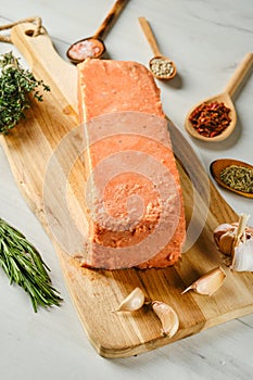 Raw pieces of salmon pressed in briquette