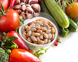 Raw pinto beans and vegetables
