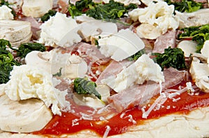 Raw pizza closeup photo