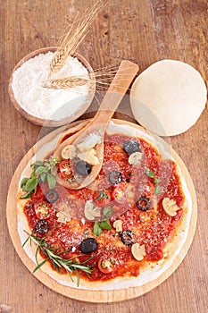 Raw pizza dough and ingredient