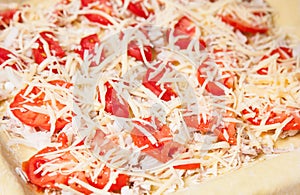 Raw pizza with vegetables