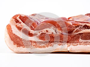 Raw pork belly isolated on white copyspace closeup