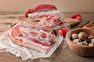 Raw pork belly on wooden table. Fresh meat products