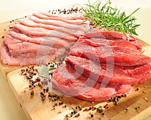 Raw pork chop and steaks for barbecue photo