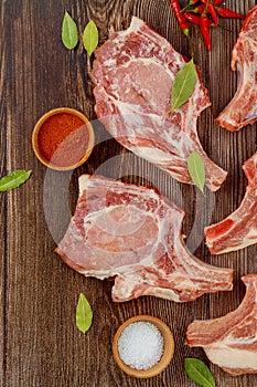 Raw pork chops with spices to make delicious dish.