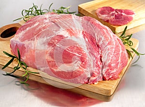 Raw pork ham on cutting board