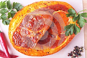 Raw Pork ham with spices, parsley leaves and chilli ready for BBQ grilling isolated on white background.