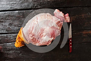 Raw pork leg and knife. butchery display