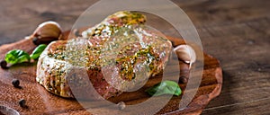 Raw Pork Loin chops marinated meat Steak for bbq on wooden table