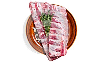 Raw pork loin spare ribs with thyme. Isolated on white background.