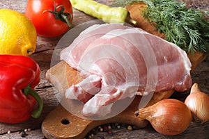 Raw pork meat closeup and fresh vegetables horizontal