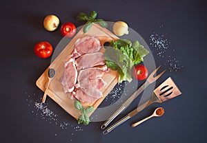 Raw pork meat. Fresh steaks on cutting board