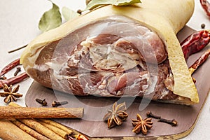 Raw pork meat - hock, knuckle or leg. Traditional ingredient for eisbein. Fresh meat, dry spices and vegetables