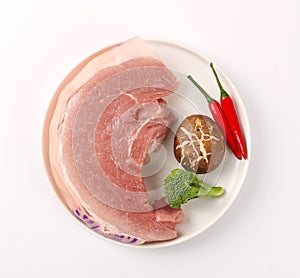 Raw pork meat isolated on white background with clipping path photo