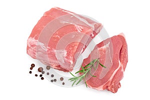 Raw pork meat with rosemary and peppercorn isolated on white background. Top view. Flat lay