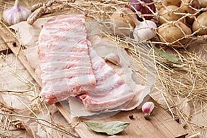 Raw pork meat - spareribs, pigs ribs. Fresh meat and ingredients