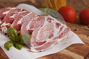 Raw pork meat with spices, wooden cutting board. Food Cooking Ingredient. Top view with copyspace.