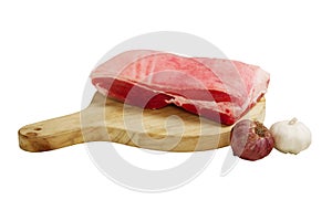 Raw pork meat on a tray and chopping board isolated on white background