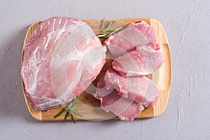 Raw pork meat on wooden background