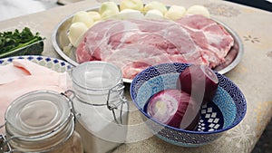 Raw pork neck meat cuts on a plate view isolated