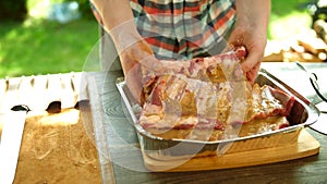 Raw pork ribs in a marinade.