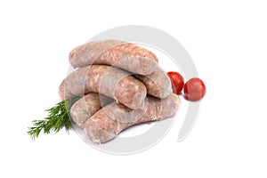 Raw pork sausages.Grilled sausages in close-up, isolated on a white background.Selective focus