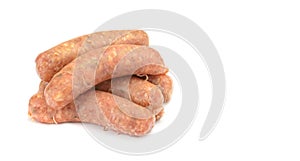 Raw pork sausages. Grilled sausages, spices close-up, isolated on a white background.Selective focus