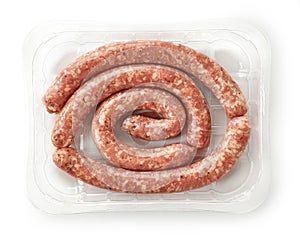 Raw pork sausages in plastic try