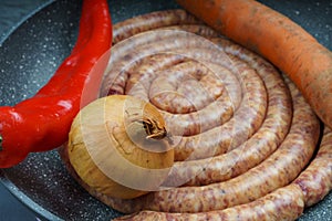 Raw pork saussage with ingredients