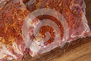 Raw pork spare-ribs with seasoned rub photo