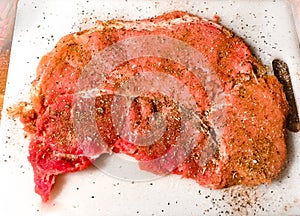 Raw Pork Steak Rubbed with BBQ Spices