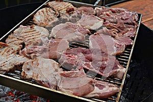 Raw Pork Steaks on the grill barbecue