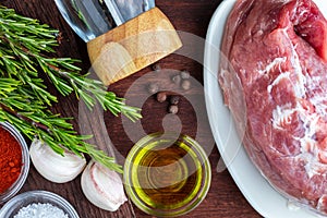 Raw pork tenderloin ready to roast, with spices