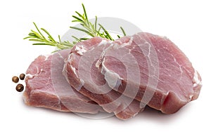 Raw pork tenderloin sirloin steaks chunks, juicy and fresh. Isolated on white background. With rosemary leaves and black