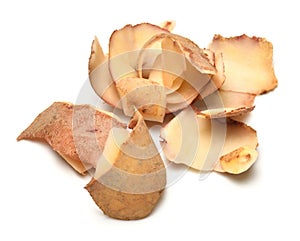 Raw potato peel close-up, group of objects are isolated on a white background