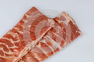 Raw prime lamb ribs isolated on white background