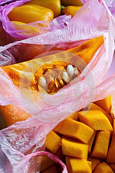 Raw pumpkin pieces in plastic bags, zero waste, smart consuming