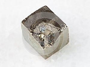 raw pyrite crystal on white marble