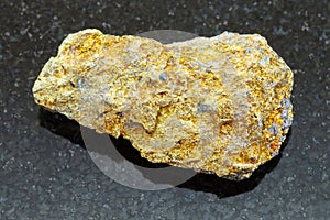 raw pyrite ore on dark background