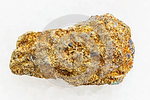 raw pyrite ore on white marble