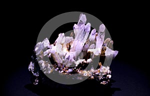 raw quartz crystal on black background