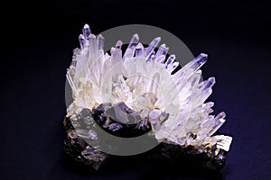 raw quartz crystal on black background