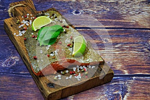 Raw rainbow trout steak in spices
