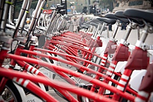 Raw of red bycicle on street