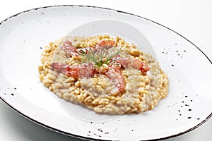 Raw red prawns on risotto Carnaroli